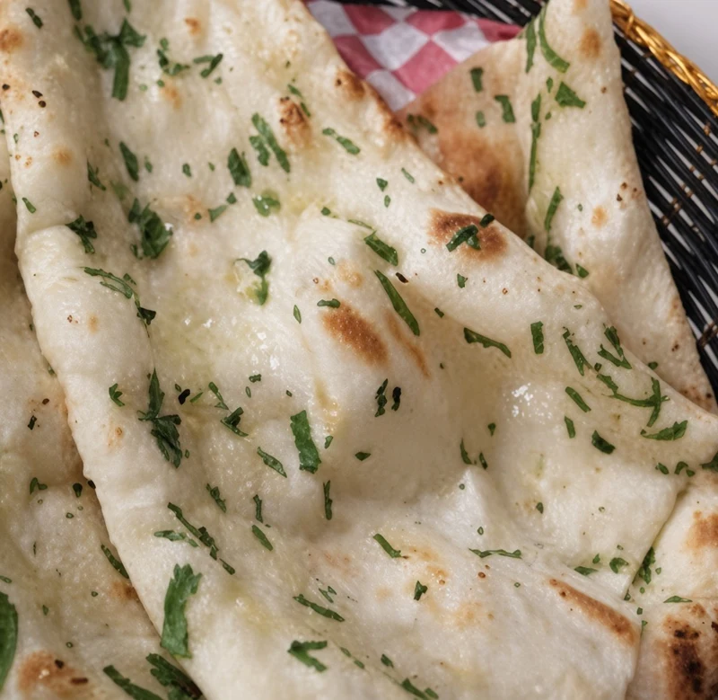 Garlic naan fresh from the tandoor at Darbar Restaurant, downtown Saskatoon